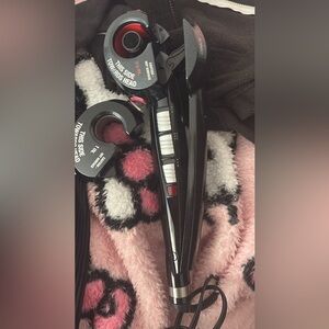 Black and White Hair Styling Tool with Red Accents